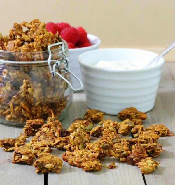 Pumpkin Spice Granola Recipe - Loaded with the flavours of fall and sweetened with honey, these chewy, spicy clusters make a great breakfast parfait.